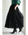 A voluminous bouquet skirt wrapped in rose flowers