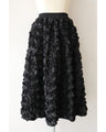 A voluminous bouquet skirt wrapped in rose flowers