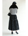 A voluminous bouquet skirt wrapped in rose flowers