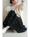 A voluminous bouquet skirt wrapped in rose flowers