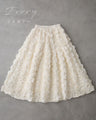 A voluminous bouquet skirt wrapped in rose flowers