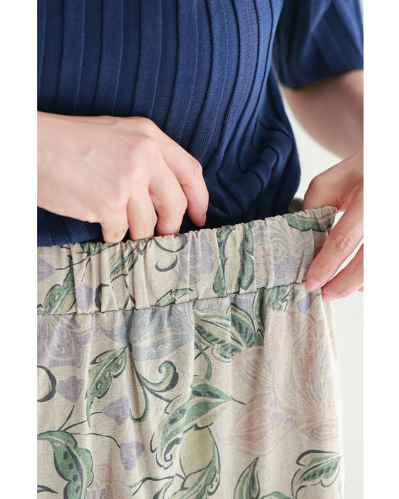 舞うような淡色花の切り替えミディアムスカート