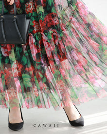  A mid-length skirt with a floral tulle pattern spread across a sheer canvas