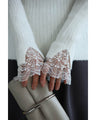 A brushed knit top with lace sleeves that cover your hands