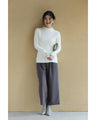A brushed knit top with lace sleeves that cover your hands