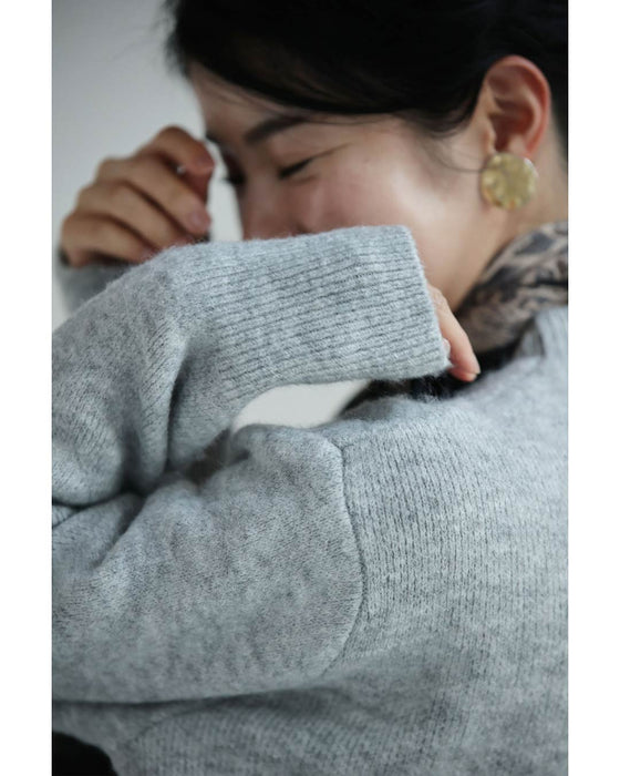 変化を楽しむハーフジップウエストのニットプルオーバートップス