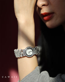  A bejeweled bracelet watch that beautifully keeps time