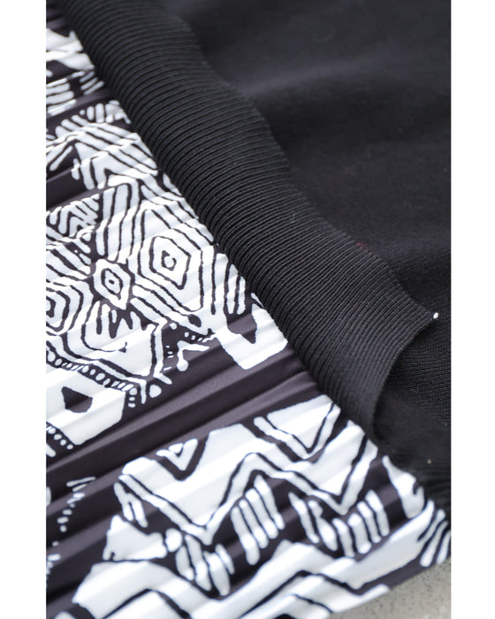 モノトーンなアートが広がるドッキングニットロングワンピース