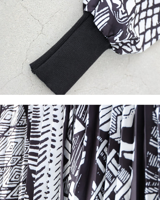 モノトーンなアートが広がるドッキングニットロングワンピース