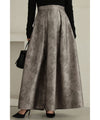 A tucked long skirt with nuanced art