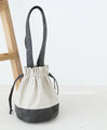 A cute and round suede drawstring bag