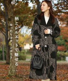  A loose-fitting cocoon coat with a captivating pattern and silhouette