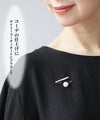 A subtle and elegant accent with a jewel and pearl pin brooch
