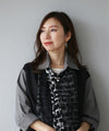 A subtle and elegant accent with a jewel and pearl pin brooch