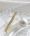 A subtle and elegant accent with a jewel and pearl pin brooch