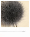 A fluffy, mature and cute Y-shaped fur necklace in grey