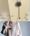 A fluffy, mature and cute Y-shaped fur necklace in grey