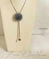 A fluffy, mature and cute Y-shaped fur necklace in grey