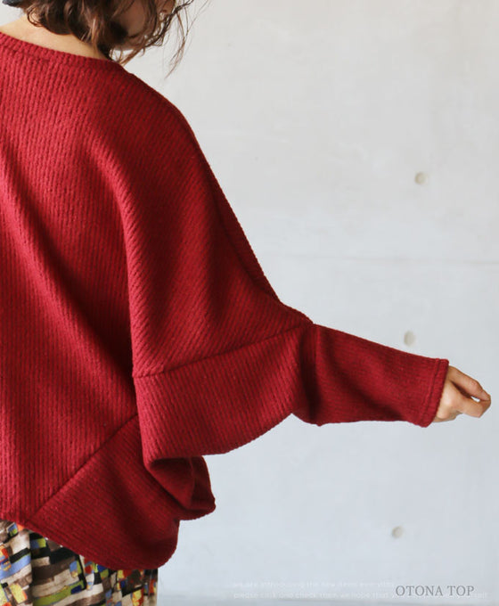 A loose-fitting adult modified dolman top in red