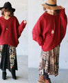 A loose-fitting adult modified dolman top in red