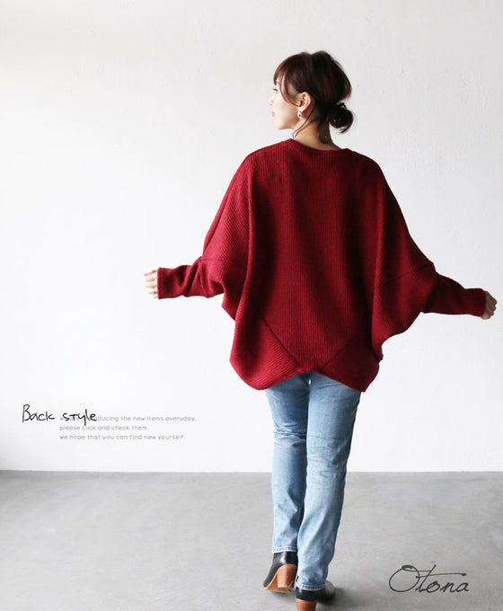 A loose-fitting adult modified dolman top in red