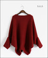 A loose-fitting adult modified dolman top in red