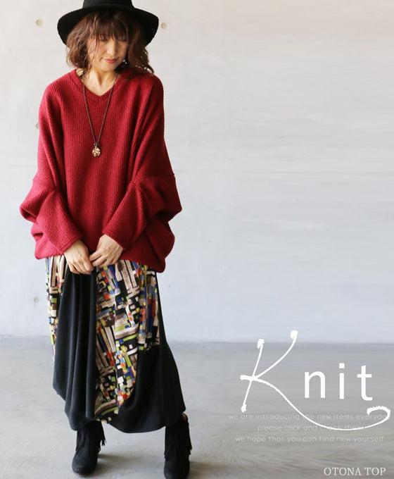 A loose-fitting adult modified dolman top in red