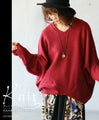 A loose-fitting adult modified dolman top in red