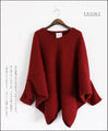 A loose-fitting adult modified dolman top in red