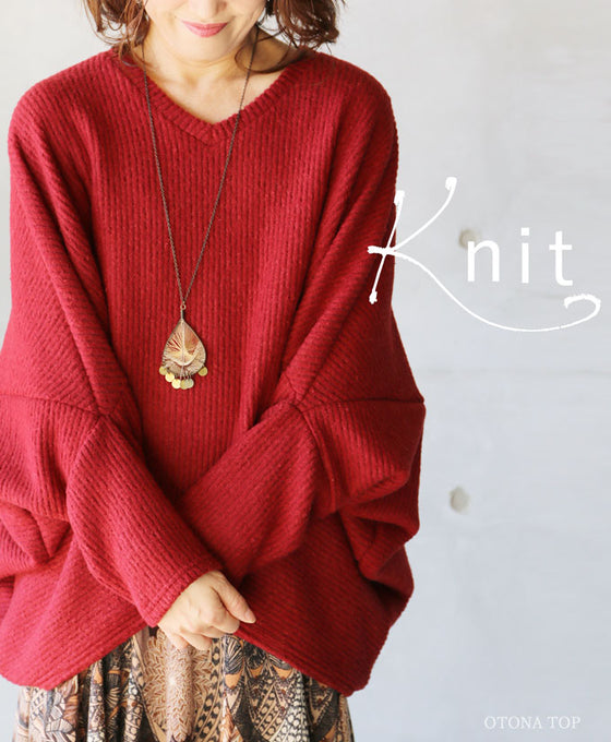 A loose-fitting adult modified dolman top in red