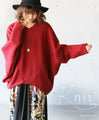 A loose-fitting adult modified dolman top in red