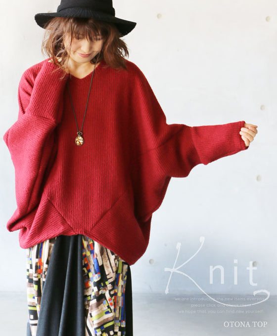 A loose-fitting adult modified dolman top in red