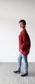 A loose-fitting adult modified dolman top in red