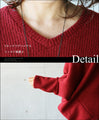 A loose-fitting adult modified dolman top in red