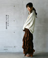 A sophisticated knit top with a mix of different materials in beige
