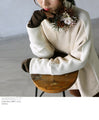 A sophisticated knit top with a mix of different materials in beige