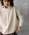 A sophisticated knit top with a mix of different materials in beige