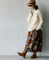 A sophisticated knit top with a mix of different materials in beige