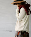 A sophisticated knit top with a mix of different materials in beige