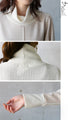 A sophisticated knit top with a mix of different materials in beige