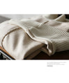 A sophisticated knit top with a mix of different materials in beige
