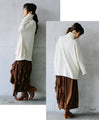 A sophisticated knit top with a mix of different materials in beige