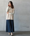 A sophisticated knit top with a mix of different materials in beige