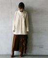 A sophisticated knit top with a mix of different materials in beige