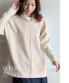 A sophisticated knit top with a mix of different materials in beige