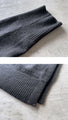 Perfectly functional and stylish, the deformed knit cardigan 