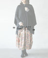 Perfectly functional and stylish, the deformed knit cardigan 