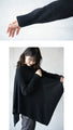 Perfectly functional and stylish, the deformed knit cardigan 