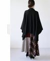 Perfectly functional and stylish, the deformed knit cardigan 