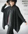 Perfectly functional and stylish, the deformed knit cardigan 